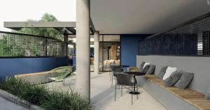 a patio with chairs and a couch and tables at Hotel In Loft Elleva Studio in Sinop