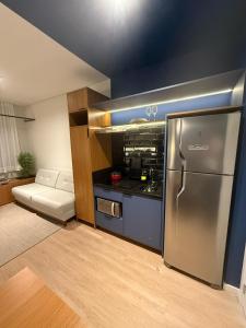 a kitchen with a stainless steel refrigerator in a room at Hotel In Loft Elleva Studio in Sinop +9 photos