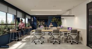 two people in an office with a table and chairs at Hotel In Loft Elleva Studio in Sinop