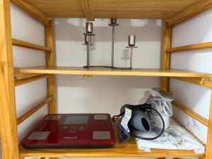 a wooden shelf with a treadmill and a blender at 和風2西北口 in Tokyo