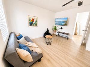 a living room with a couch and a table at The Madison by the Gold Nests in Hollywood