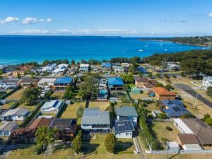 an aerial view of a small town next to the ocean at Sundance - Collingwood Beach holiday home in Vincentia