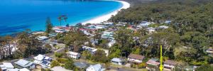 an aerial view of a town next to the beach at Bowen View - pet-friendly home near Hyams Beach in Hyams Beach