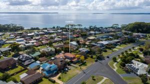 an aerial view of a town next to the water at Karinya Jervis Bay - 4BR home & optional studio in Vincentia