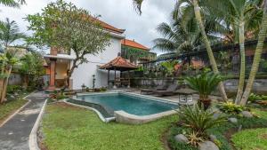 a pool in the backyard of a house at Sriwedari 40 Ubud in Ubud