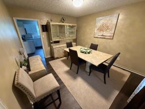 a kitchen and dining room with a table and chairs at Marvielous Stay in Jacksonville
