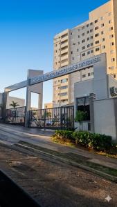 a building with a sign that reads the american tobacco day bureau at Apartamento Compacto Localização Privilegiada in Uberaba