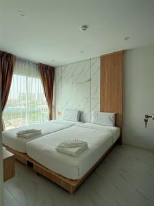 Postel nebo postele na pokoji v ubytování Dday Luxury Pattaya by D-Eco Wellness Centre + 146 fotografií