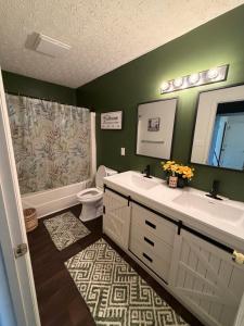 a bathroom with a sink and a toilet and a shower at Marvielous Stay in Jacksonville +41 photos