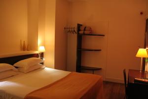 Postel nebo postele na pokoji v ubytování Hotel La Beauze