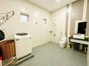 a bathroom with a sink and a toilet in it at LaLa Villa Đà Lạt in Da Lat +28 photos