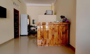 a kitchen with a wooden counter in a room at Đại Thắng Hotel in Danang
