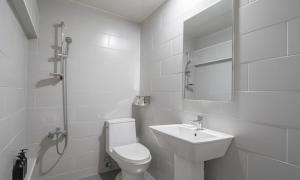 a white bathroom with a toilet and a sink at Uiwang Nine Hotel in Uiwang +31 photos