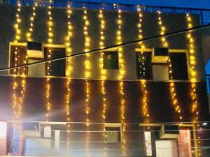 a building with lights on the side of it at Fab Krishna hotal in Panchkula
