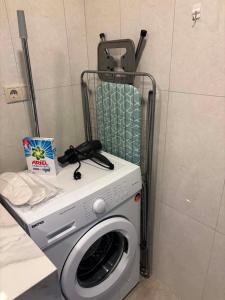 a washing machine with a bag on top of it at Alvina 29 in Tsaghkadzor