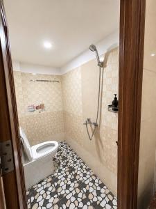 a bathroom with a toilet and a shower at Đại Thắng Hotel in Danang +27 photos