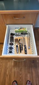 a drawer full of kitchen utensils in a cabinet at 2 Bedrooms Guest Suite in Victoria in Victoria