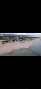 a view of a beach from an airplane at Танхаус Коттедж in Bosteri +8 photos