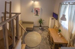 a small living room with a table and a couch at Inga Vacation House in Druskininkai