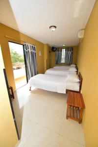 Postel nebo postele na pokoji v ubytování Hotel La Aldea