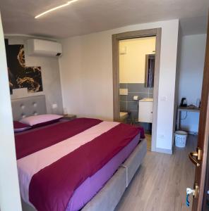 a bedroom with a large bed in a room at B&B Island View in Parzanica