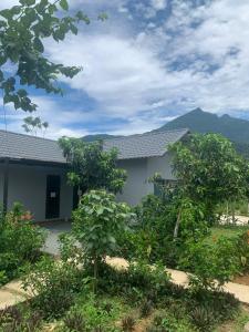 a house with trees in front of it at Educational Eco Ba Vi in Thủ Pháp