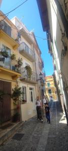 a group of people walking down a street at Nest Scilla in Scilla