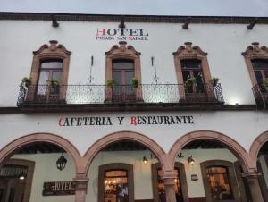 a building with a sign for a hotel at Hotel Posada San Rafael in Pátzcuaro