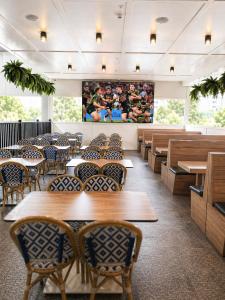 a dining room with wooden tables and chairs at Tahmoor Inn in Tahmoor +5 photos