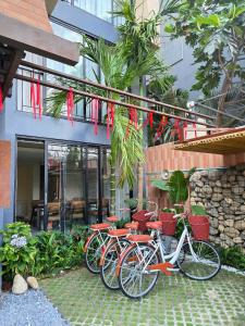 a group of bikes parked outside of a building at REFUEL NEST Boutique Hotel in Danang