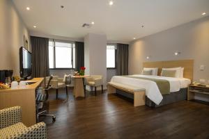 Rúm í herbergi á Unipark by Oro Verde Hotels