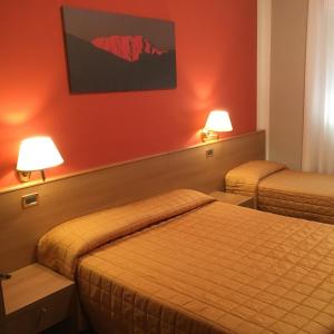 Ένα ή περισσότερα κρεβάτια σε δωμάτιο στο Hotel Miravalle 2000 +53 φωτογραφίες