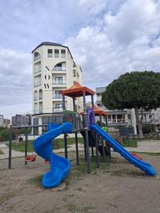 a playground with a slide and a slideintend at Now Boutique Hotel in Erdemli