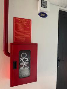 a cell phone in a red box on a wall at Nhà trọ bùi Thị lài in Dong Hoi