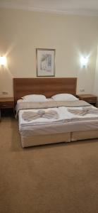 a bedroom with two beds in a room at Apartment SunSet rezort - sea wiew in Pomorie +22 photos