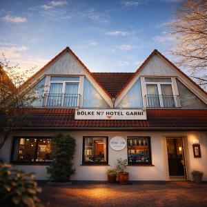 a building with a sign that reads spike my hotel caravan at Hotel Bölke in Wunstorf
