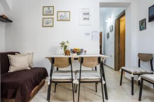 a room with a table with a bowl of fruit on it at Dimitra's House in Glossa