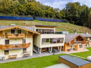 an aerial view of a house with a hill at Chalet in Stuhlfelden near Ski Slopes in Stuhlfelden +32 photos