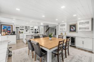 a kitchen and dining room with a wooden table and chairs at 1055 Shady Lane in Merritt Island