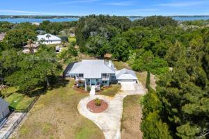 an aerial view of a white house with a garden at 5665 S. Tropical Trail in Merritt Island