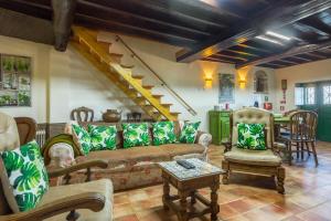 a living room with a couch and a table at Casa Mont'Santo with Balcony & Terrace in Monsanto +31 photos
