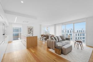 a living room with a couch and a table at Sal D’Ouro Skyline & Sea Views in Canidelo
