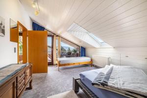 a bedroom with a bed and a skylight at Studio Wacholderheide in Albstadt