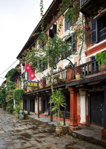 a building with a sign on the side of it at The Old Inn in Bandipur +18 photos