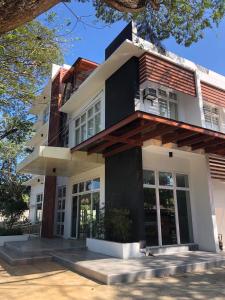 a house with black and white at Bambu Suites in Puerto Princesa City