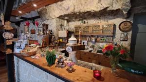 a bar in a room with a stone wall at Ratskeller Geising in Geising