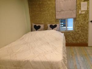 מיטה או מיטות בחדר ב-Rada Phan