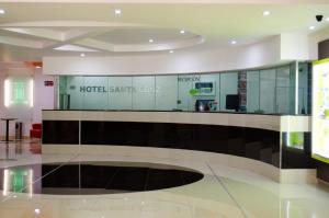 a lobby of a hotel with a check in counter at Hotel Santa Cruz in Mexico City