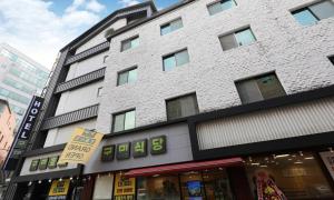 a store front of a building in a city at Gukmin Hotel in Gumi