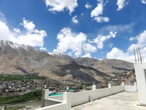 a view of the mountains from the roof of a building at The Apricot Palace in Kargil